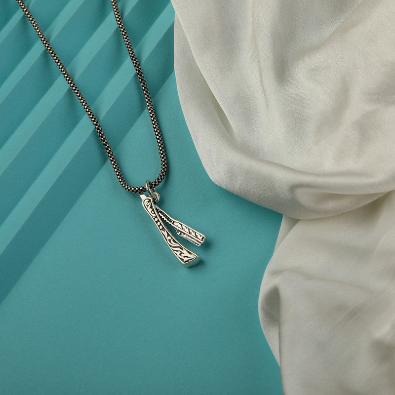 Men’s 925 Sterling Silver Tattoo Pendant with Detailed Artistic Design displayed on surface