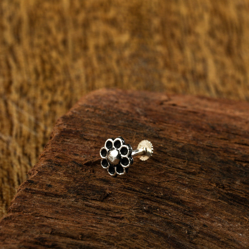 925 sterling silver teardrop nose pin on wooden surface – traditional silver nose accessory