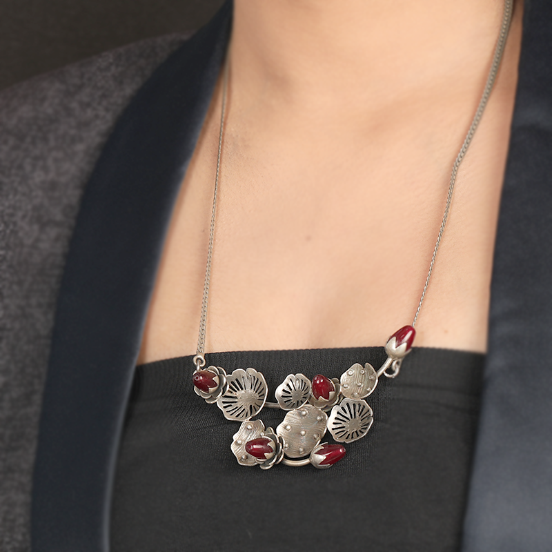 Stylish oxidized silver lotus bud necklace paired with ethnic attire, perfect jewelry for special occasions