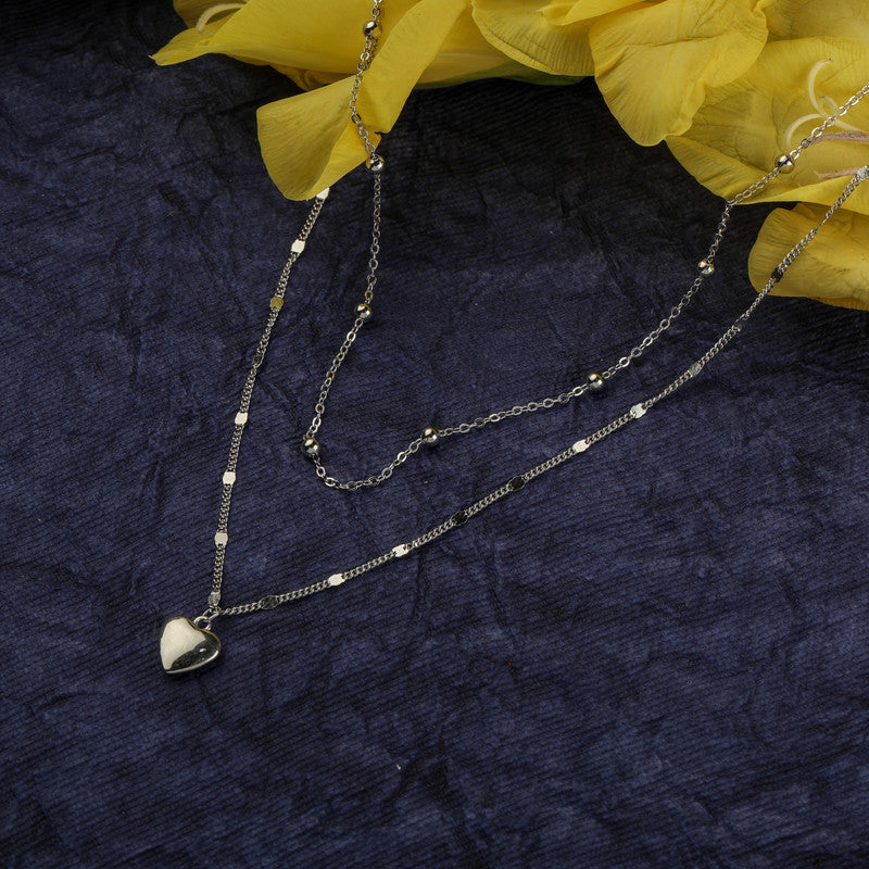Elegant silver double heart necklace on fabric — perfect gift choice for Diwali and Karwa Chauth.