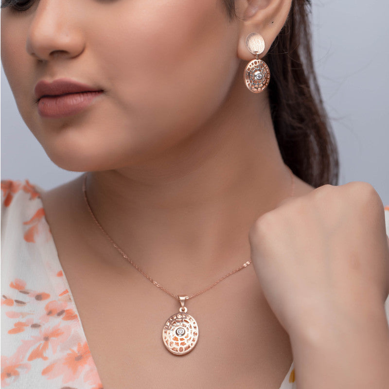 Woman wearing silver oval filigree pendant, stylish accessory for festivals and parties.