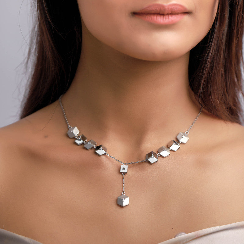 Woman wearing 925 silver pyramid charm necklace — stylish layered jewellery for everyday wear.