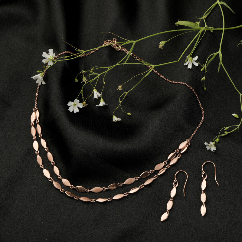 Stunning twisted rose gold necklace in silver, glowing beautifully for Diwali nights and celebrations.