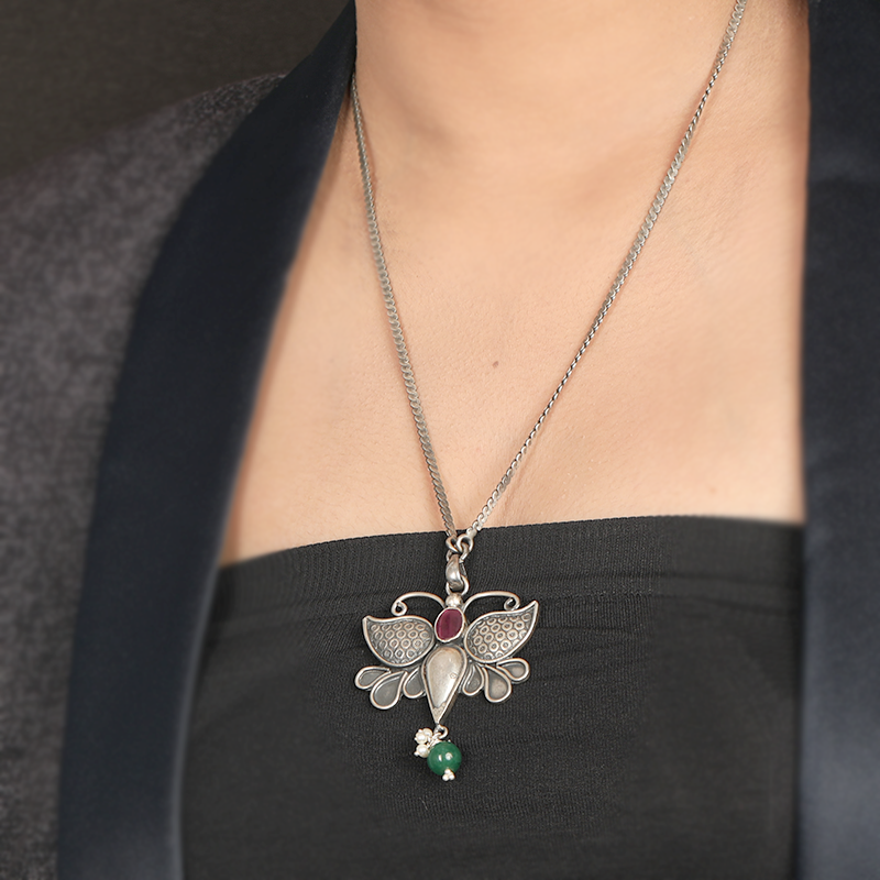 Butterfly pendant antique silver necklace styled with saree for Navratri, Diwali, and bridal wear