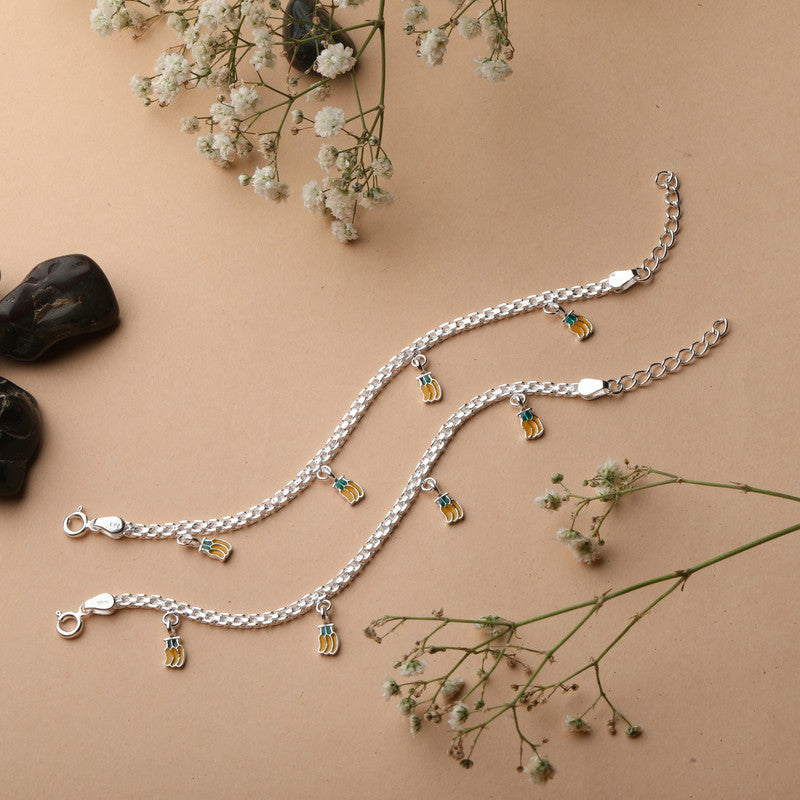 Banana baby girl anklet displayed with props – playful silver accessory for kids