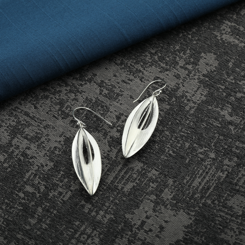 925 Silver Celestial Charms Earrings displayed as prop image on festive background – stylish silver earrings with fine detailing.