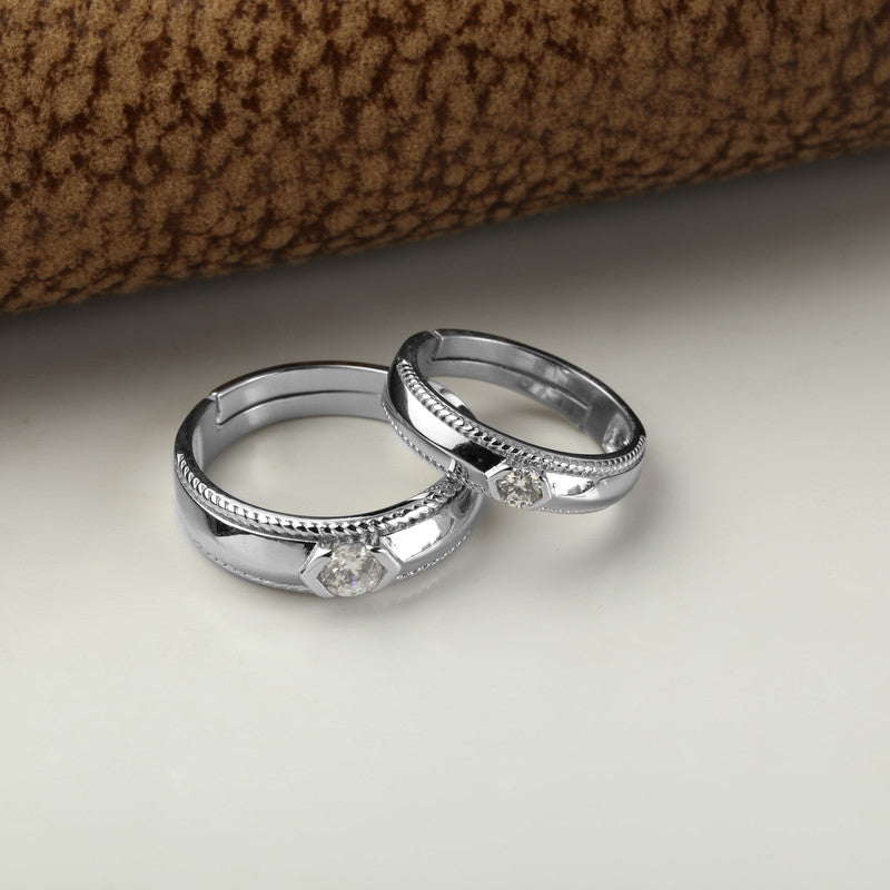 Classy 925 silver couple rings displayed with props – romantic silver accessory set