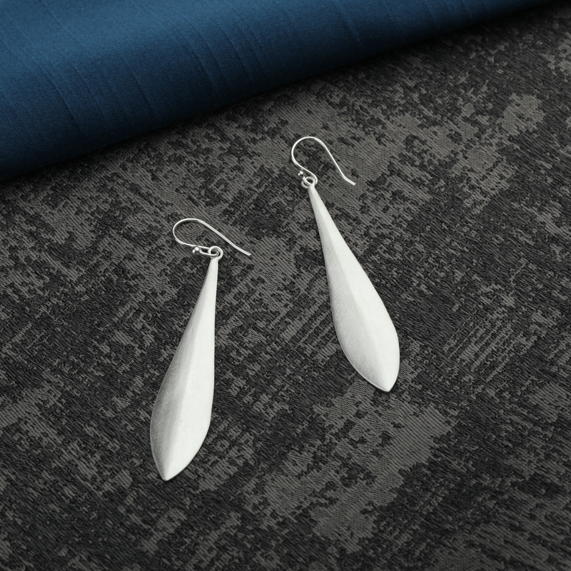 925 Silver Dainty Delights Earrings displayed as prop image on festive background – stylish silver earrings with fine detailing.