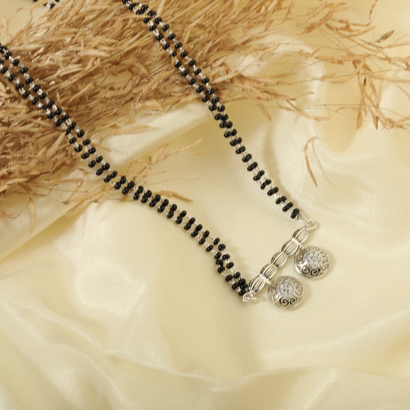 925 Silver Divine Duo Mangalsutra displayed on festive background – traditional silver jewellery with graceful design.