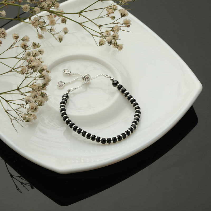 Kids Lucky Charm Nazariya Bracelet with Lucky Charm styled on fabric background