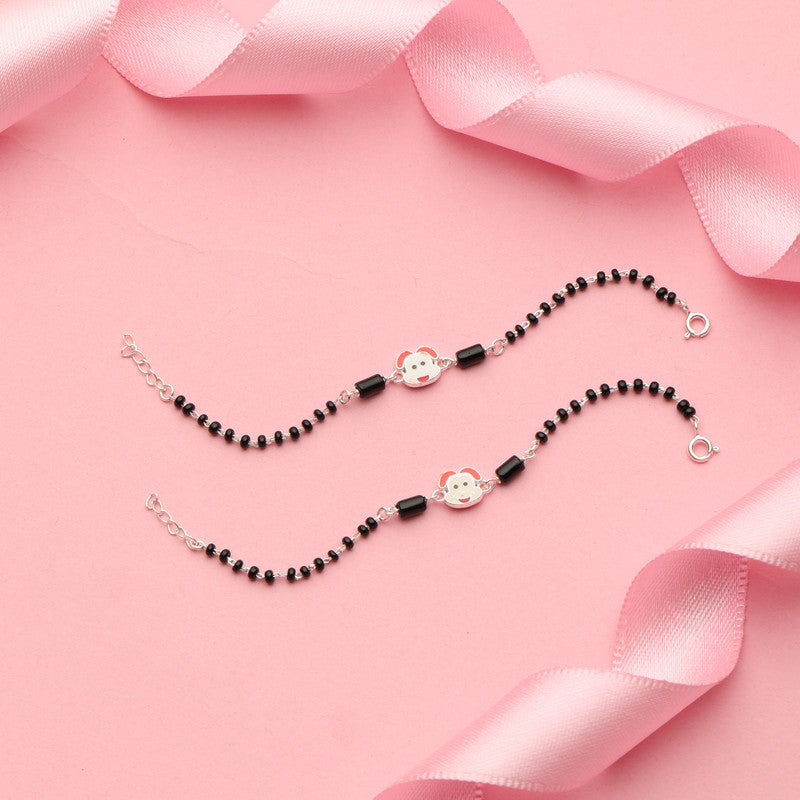 Kids Silver Bunny Nazariya Bracelet with Bunny Charm styled on fabric background