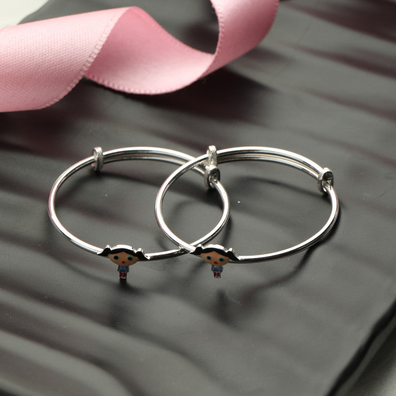 Kids Silver Kitty Doll Kada with Kitty Charm styled on fabric background