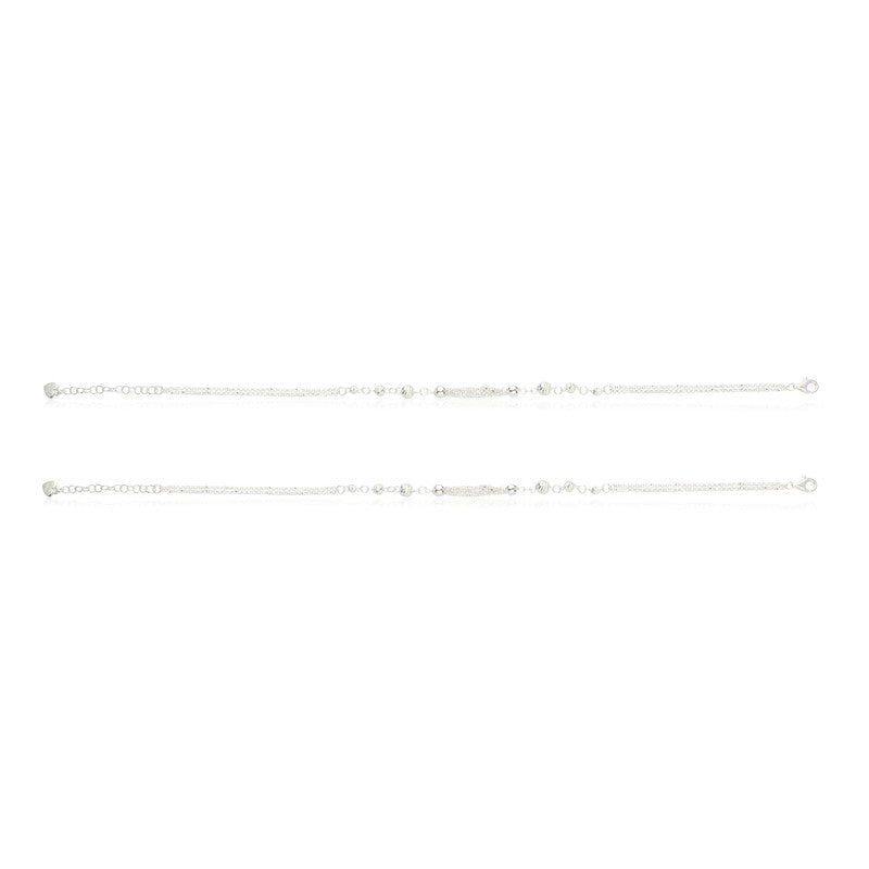 Minimalist layered silver anklet with ball charms, chic choice for Bhai Dooj gifts and wedding outfits.