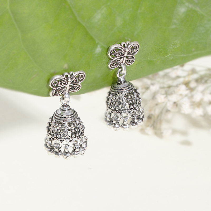 Designer Oxidized Silver Butterfly Jhumka Earrings with Artistic Backdrop – Traditional 925 Silver Jewellery for Festivals and Special Occasions
