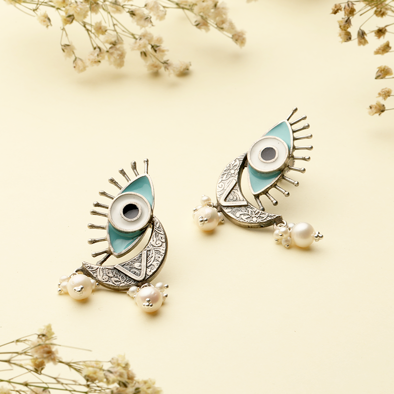 Designer Oxidized Silver Evil Eye Earrings with Ethnic Backdrop – Fashionable Silver Jewellery for Navratri, Weddings and Celebrations
