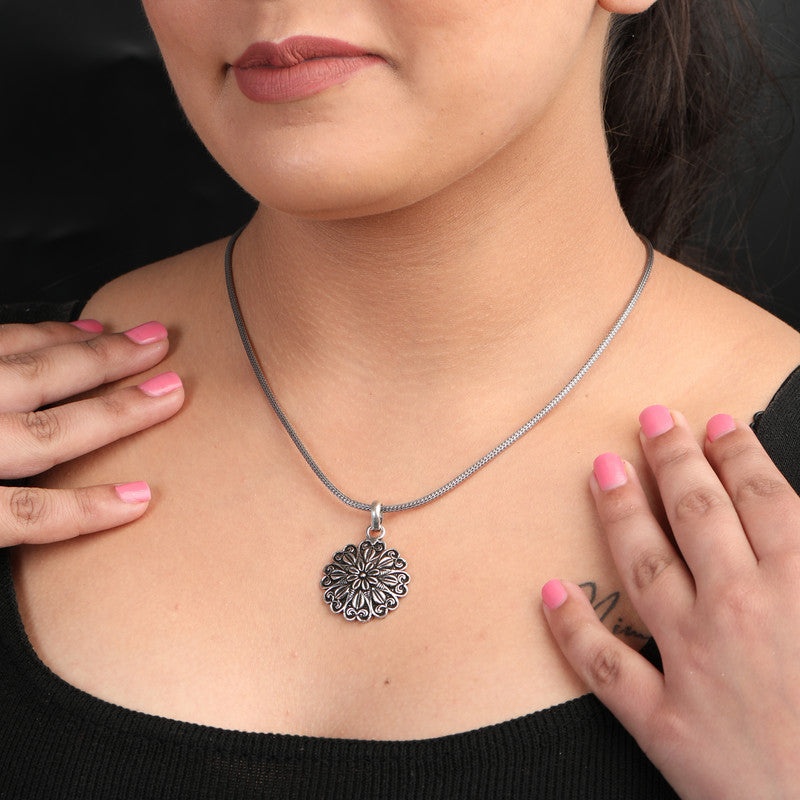 Woman wearing Oxidized Silver Graceful Flower Pendant – stylish oxidized jewelry for Navratri, Diwali, weddings and ethnic celebrations