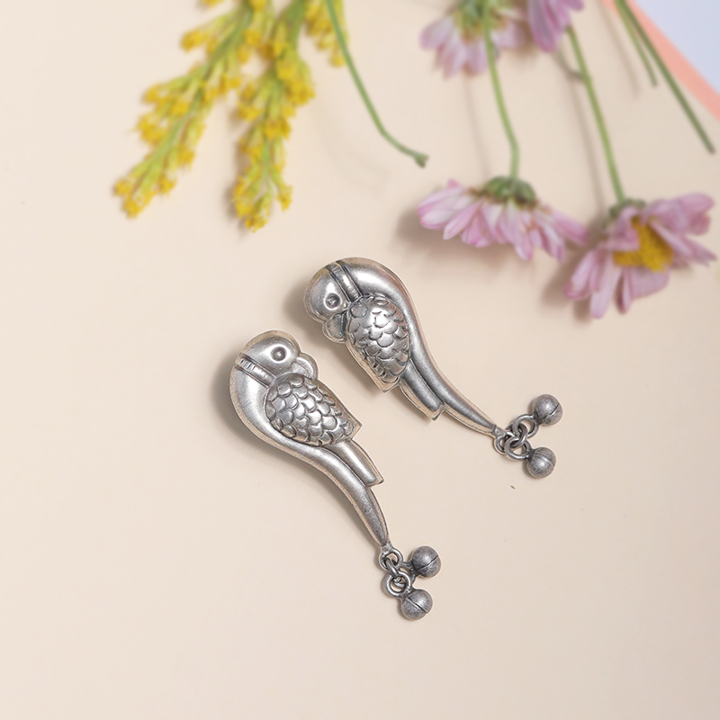 Designer Oxidized Silver Parrot Earrings with Ethnic Backdrop – Elegant Silver Jewellery for Festive Celebrations