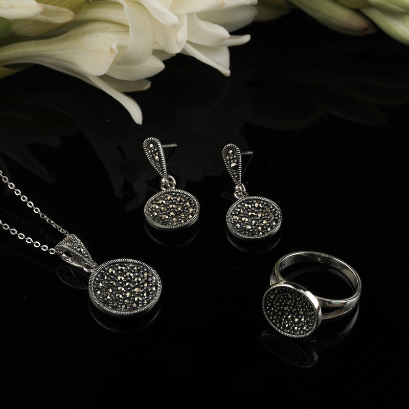 Oxidized Silver Round Disc Pendant displayed on festive prop – Raksha Bandhan and Bhai Dooj gift idea