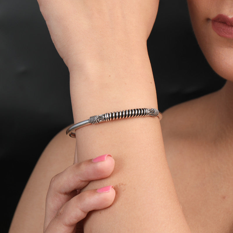 women wearing 925 Oxidized Silver Bangle in tribal spiral design