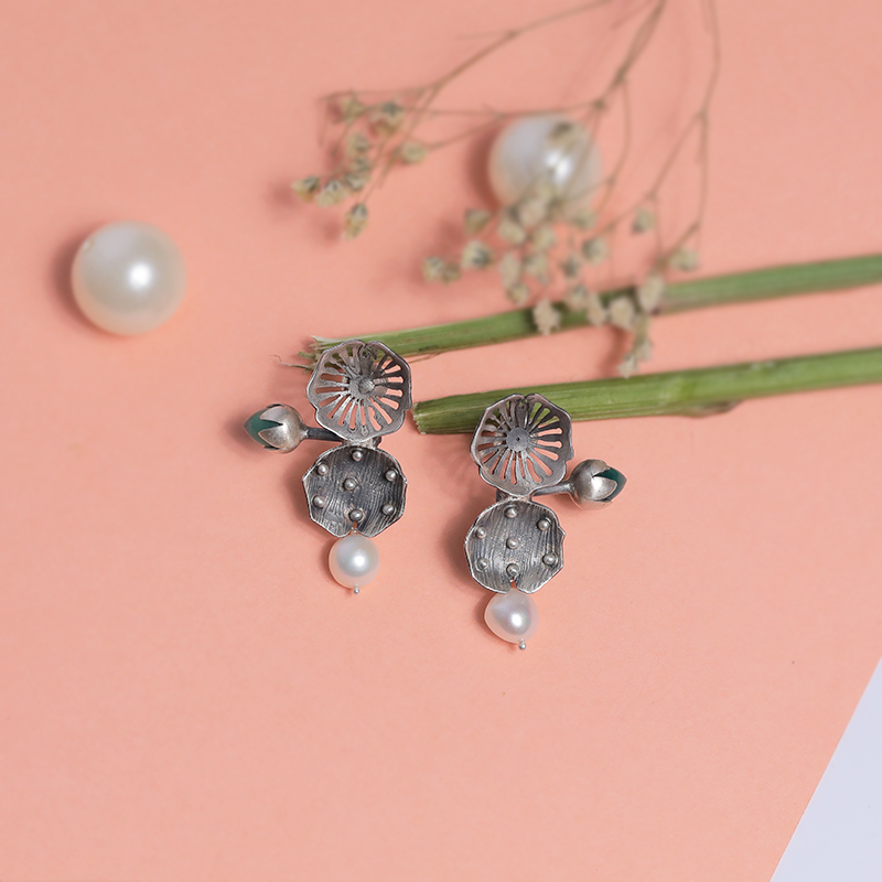 Oxidized silver flower bud design stud earrings – trendy festive accessory for sarees, lehengas, and ethnic fashion