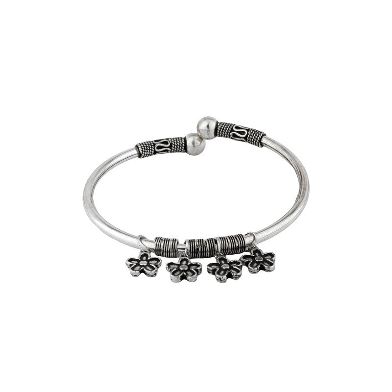 Oxidized Silver Kada with flower charms on white background
