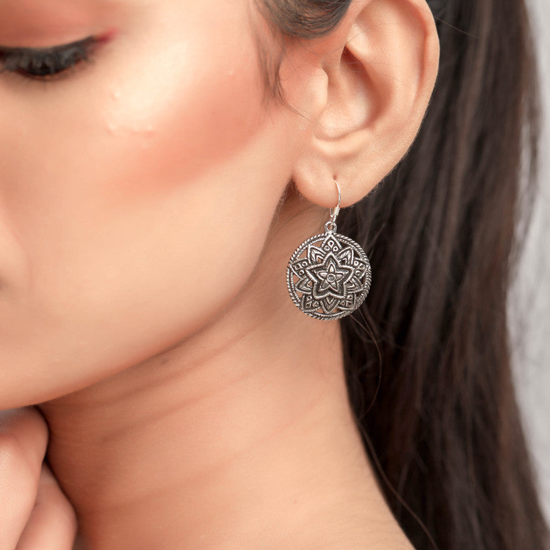 Oxidized silver mandala earrings on model – stylish statement accessory for weddings, Karwa Chauth, and cultural events