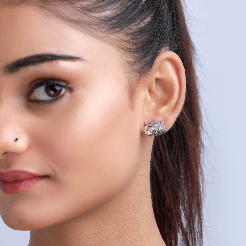 Elegant oxidized silver owl stud earrings on model – ethnic jewelry for weddings and cultural events