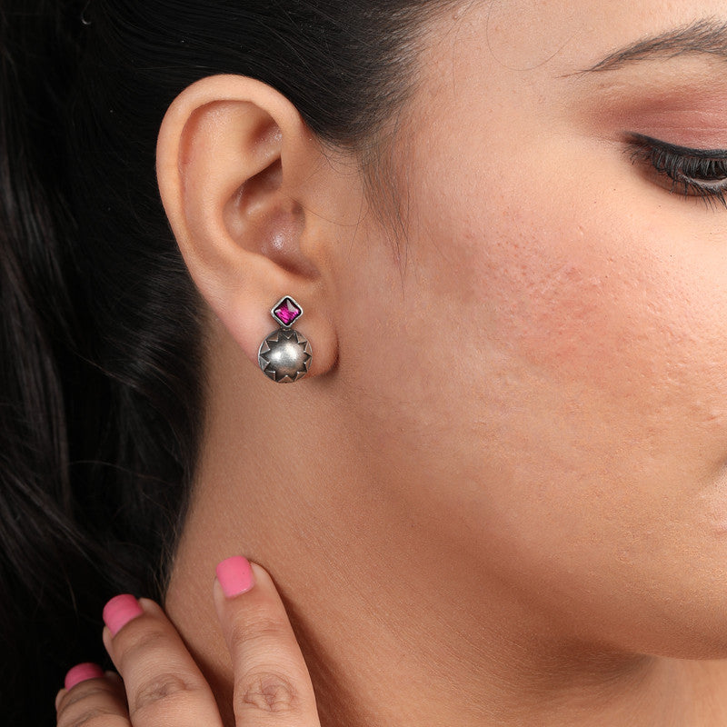 Oxidized silver ruby stud earrings on model – ethnic red stone jewelry for weddings and traditional celebrations