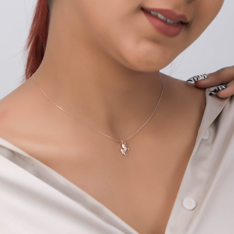 Model showcasing Rose Gold Unicorn Pendant Necklace – trendy festive accessory for celebrations