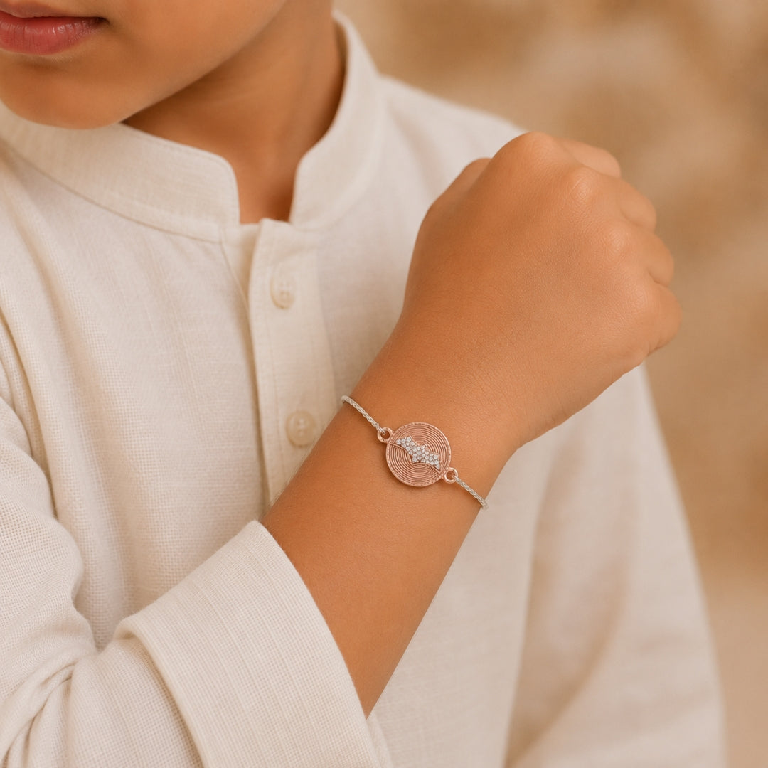 Silver Batman Rakhi for Kids placed with roli chawal and festive decor – premium 925 silver kids Raksha Bandhan gift by Silviya.