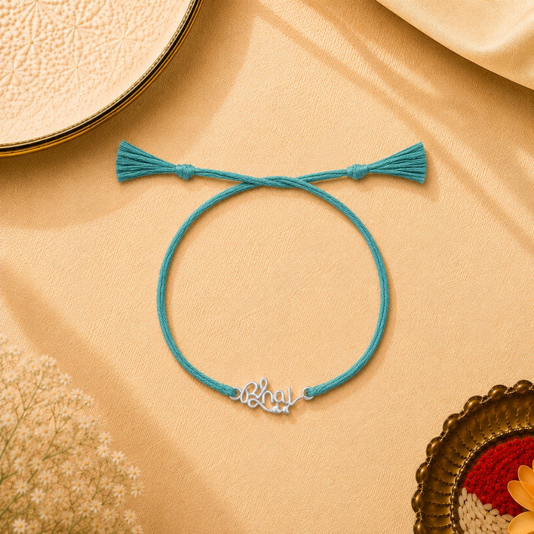 Silver Bhai Letter Rakhi is placed with roli chawal and festive decor – premium 925 silver Raksha Bandhan gift by Silviya.