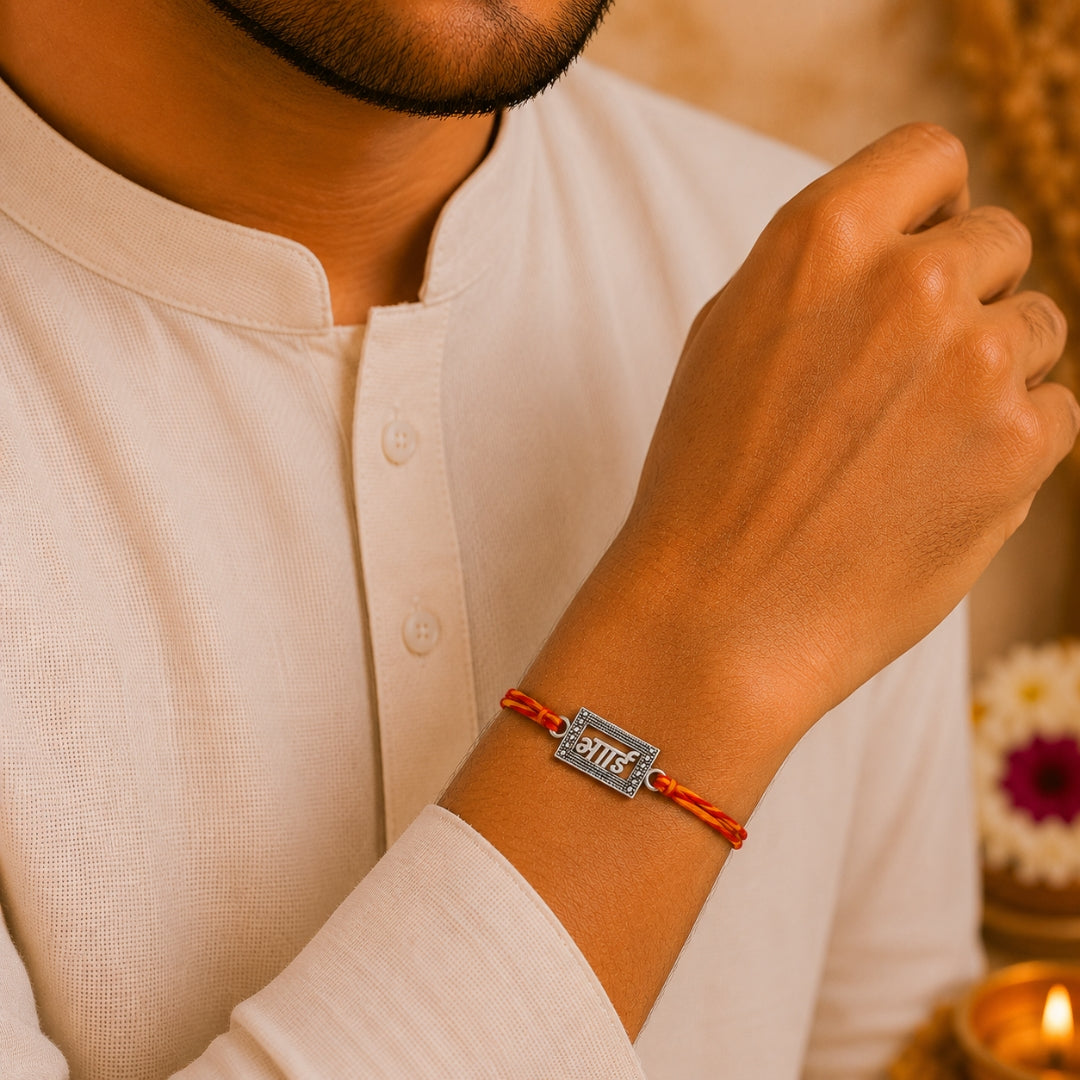 Brother wearing Silver Bhai Rakhi by Silviya – stylish 925 silver rakhi for Raksha Bandhan.