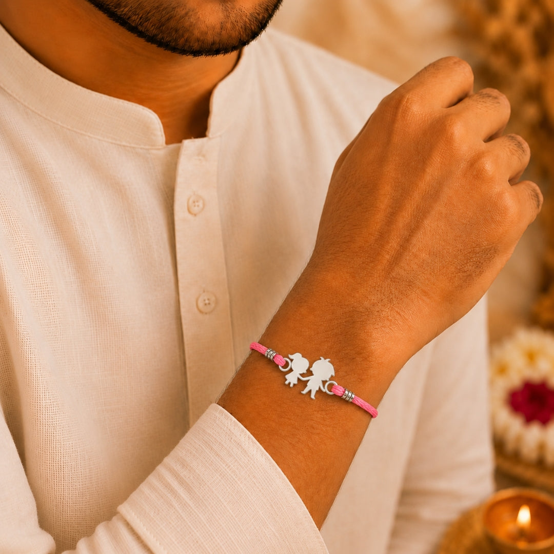 Brother wearing Silver Brother Sister Duo Rakhi by Silviya – 925 silver rakhi for Raksha Bandhan.