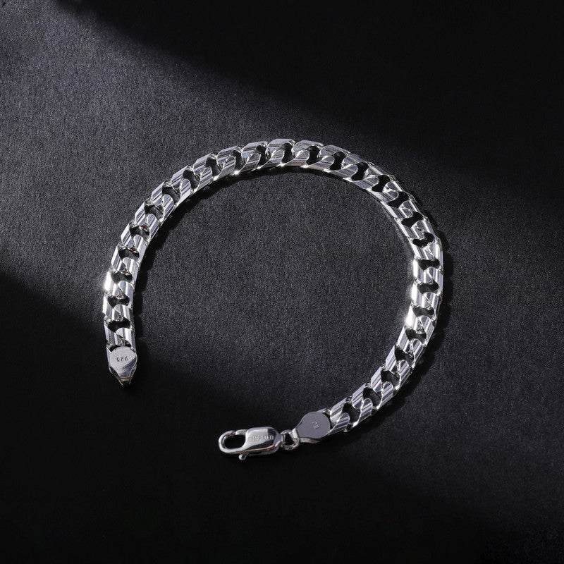 Close-up of Silver Cuban Link Bracelet on white background