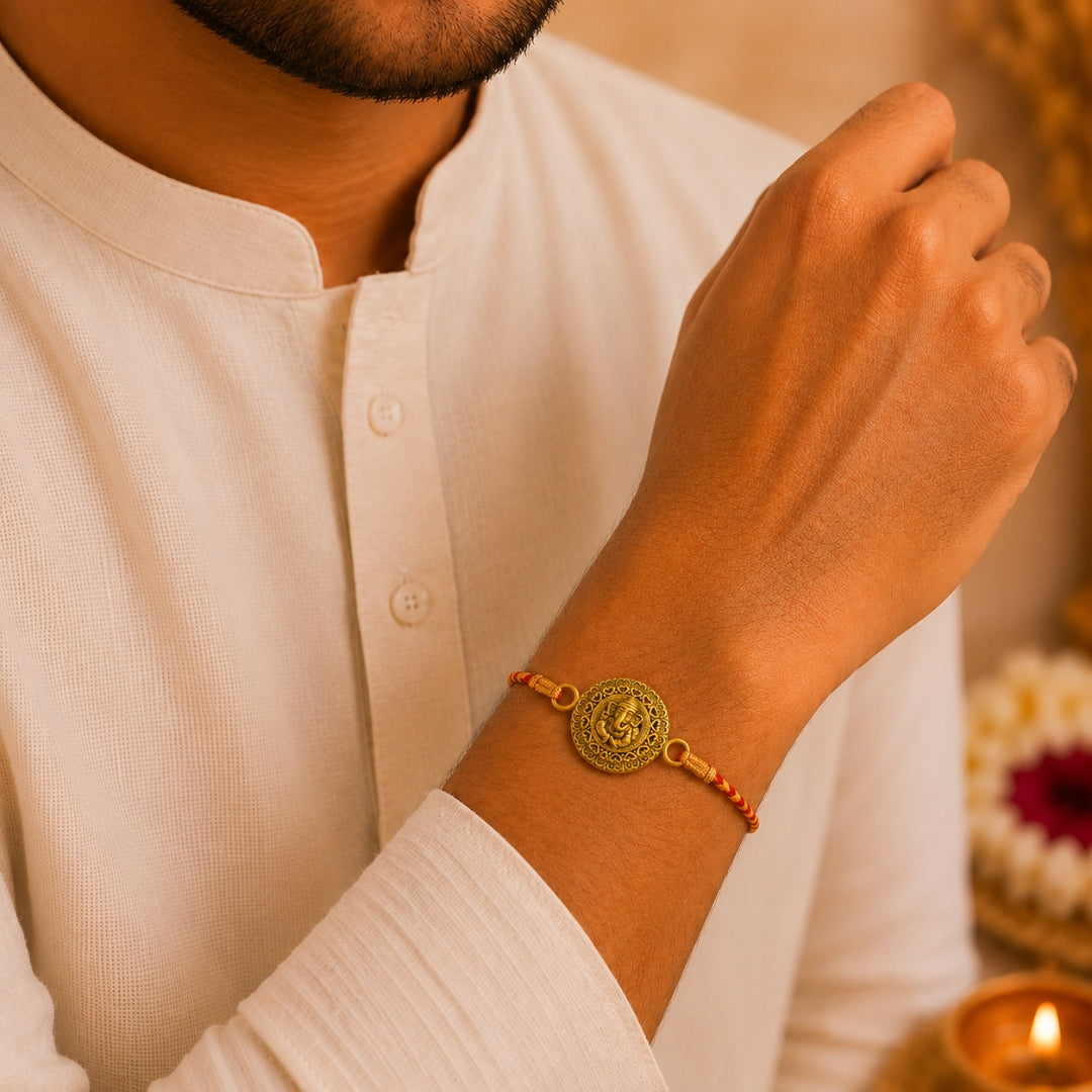 Brother wearing Silver Embossed Lord Ganesha Rakhi by Silviya – 925 silver rakhi for Raksha Bandhan.