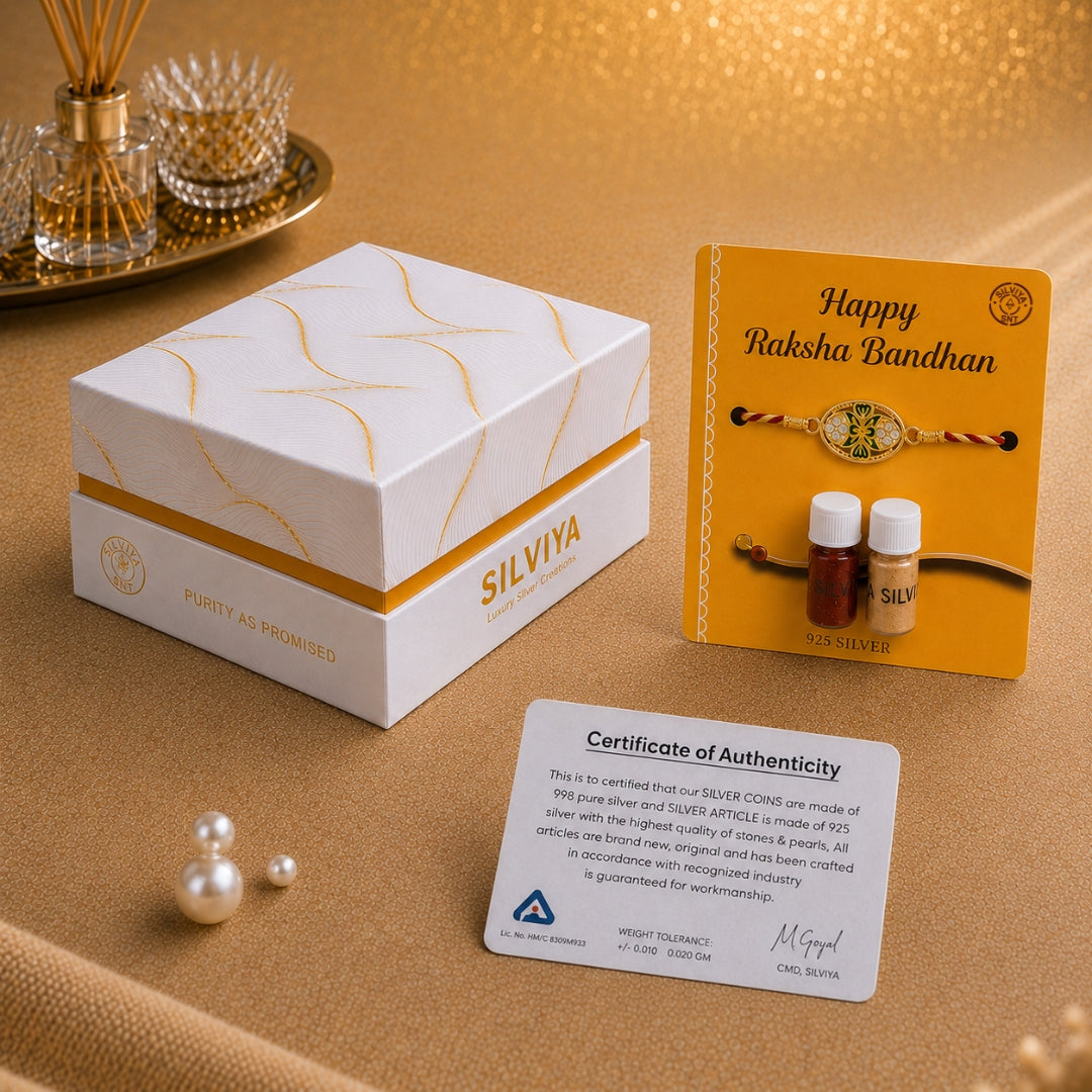 Premium Silviya packaging for Silver King Oval Meena Art Rakhi – elegant 925 silver Raksha Bandhan gift for brother.