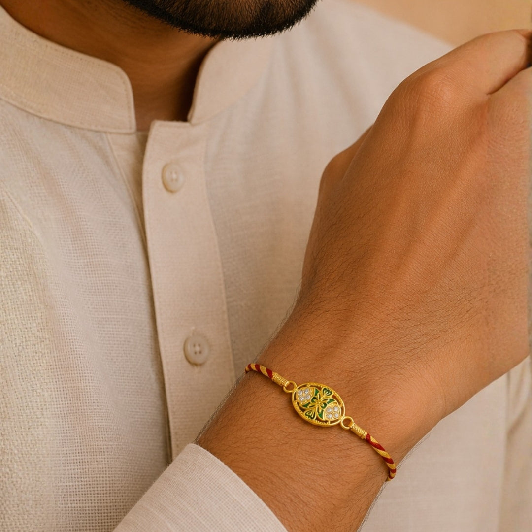 Brother wearing Silver King Oval Meena Art Rakhi by Silviya – pure 925 silver rakhi design for Raksha Bandhan.