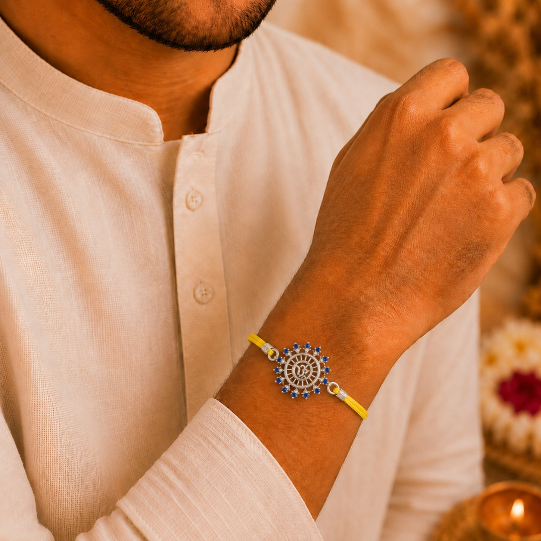 Brother wearing Silver Om Sun Rakhi by Silviya – 925 silver rakhi for Raksha Bandhan.