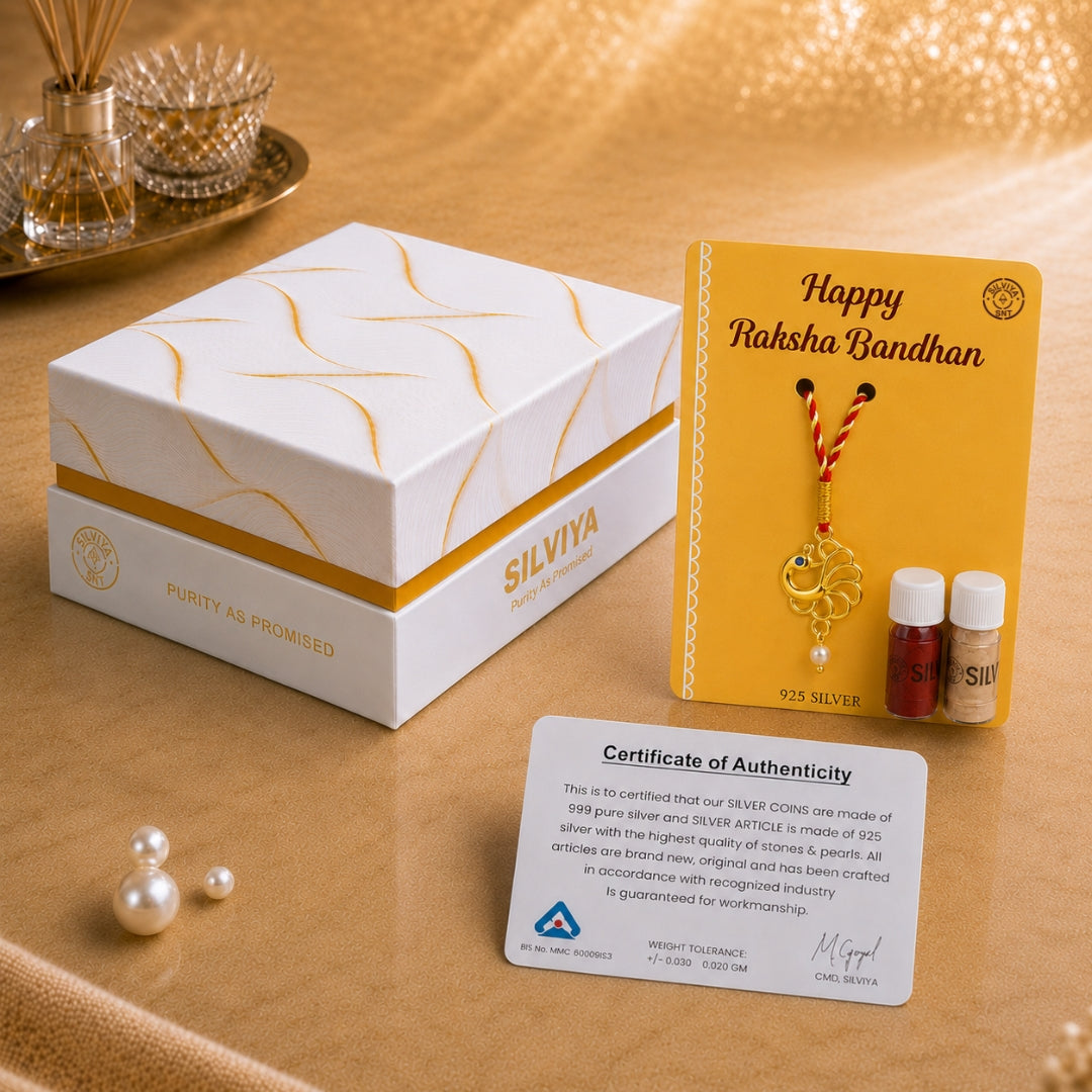 Silviya premium packaging for Silver Peacock Lumba Rakhi for bhabhi – elegant gift box with purity card.