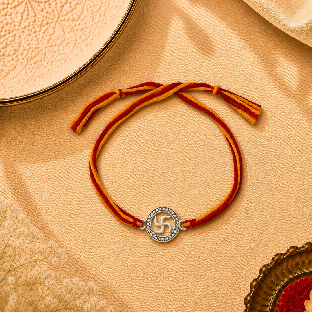 Silver Swastik Rakhi placed with roli chawal and festive decor – premium 925 silver Raksha Bandhan gift by Silviya.