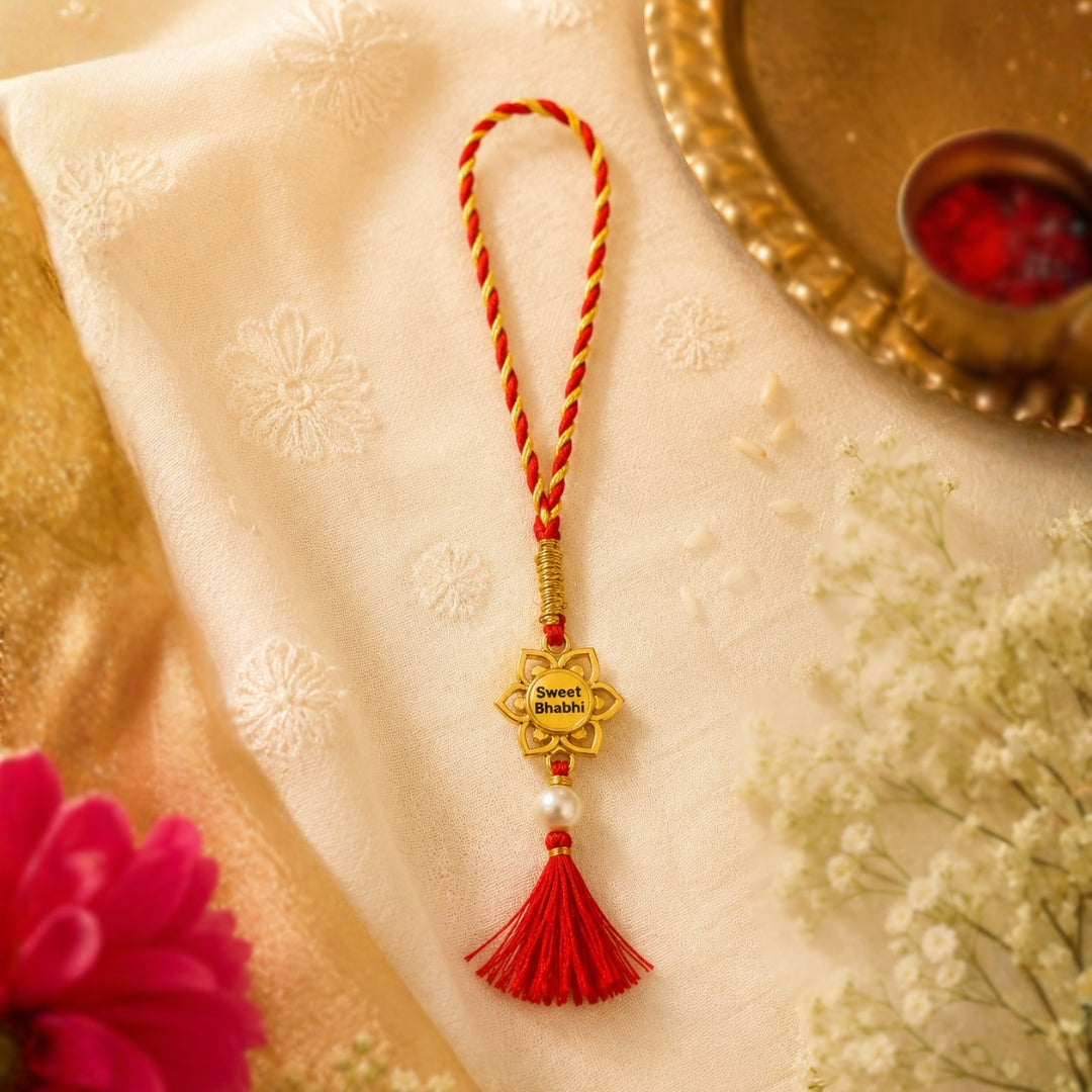 Silver Sweet Bhabhi Lumba Rakhi is placed with roli, chawal and festive decor – a premium 925 silver Raksha Bandhan gift by Silviya.
