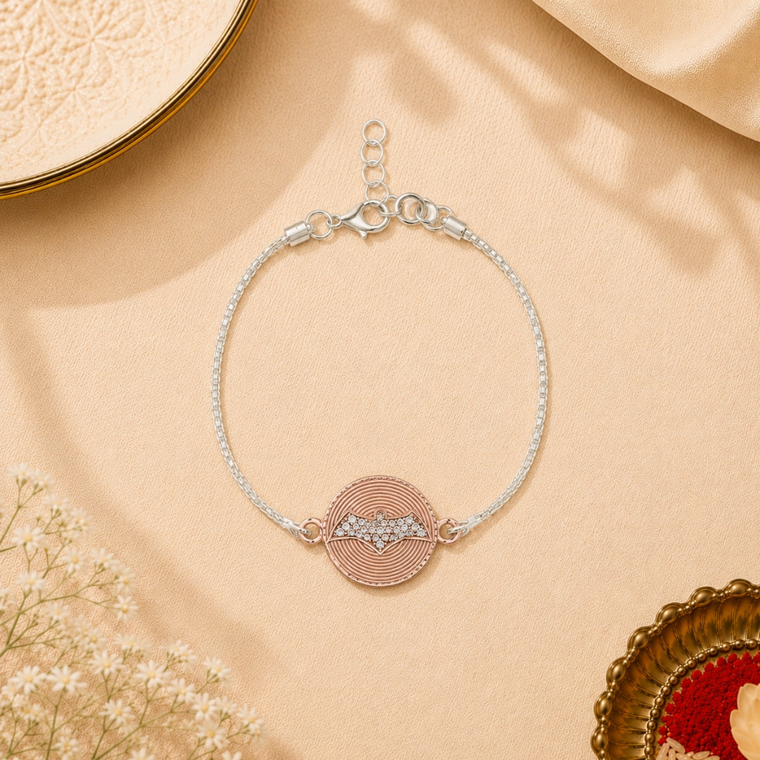 Silver Batman Rakhi for Kids placed with roli chawal and festive decor – premium 925 silver kids Raksha Bandhan gift by Silviya.