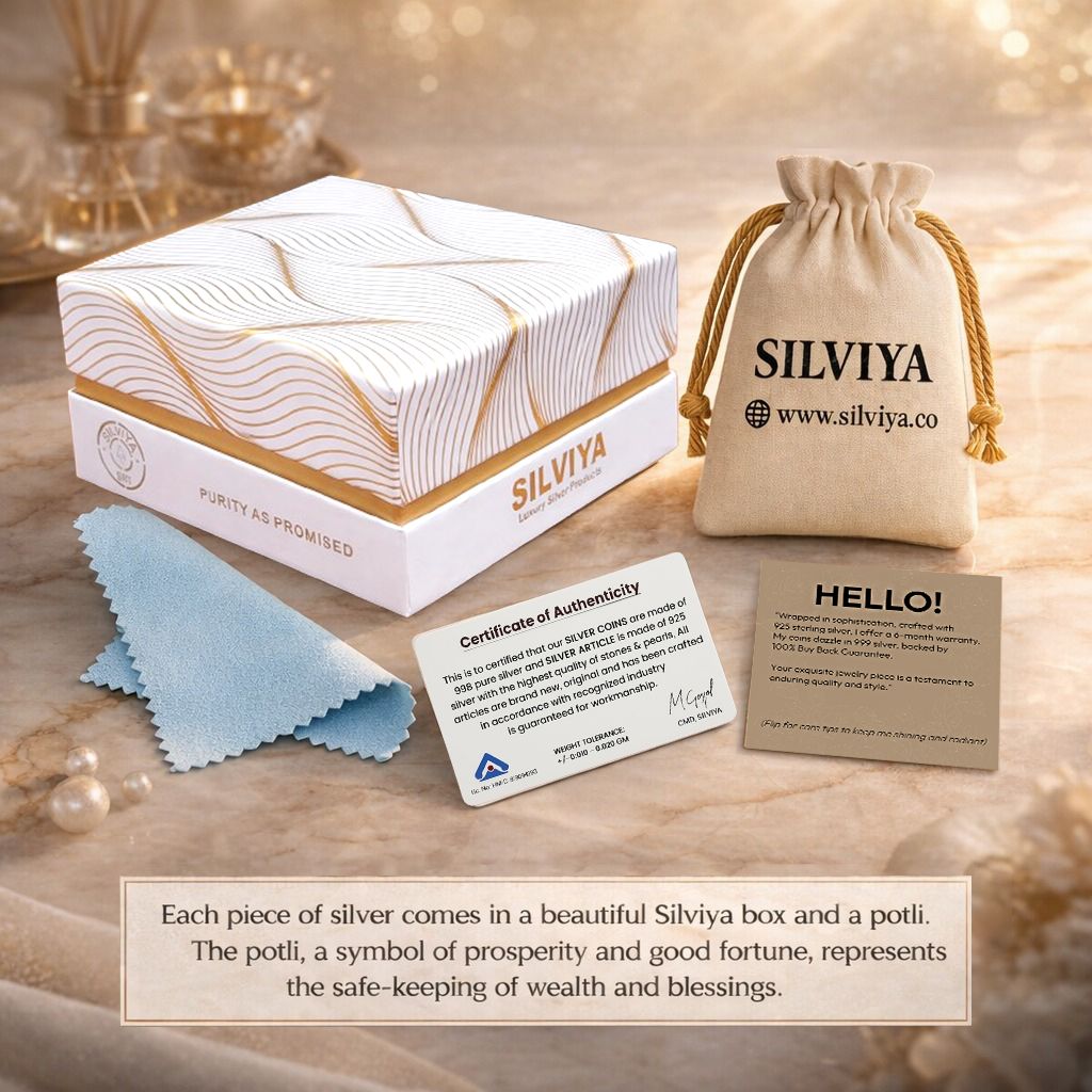 Silviya premium silver jewellery packaging featuring an elegant branded box, fabric potli pouch, certificate of authenticity, cleaning cloth, and Hello card.