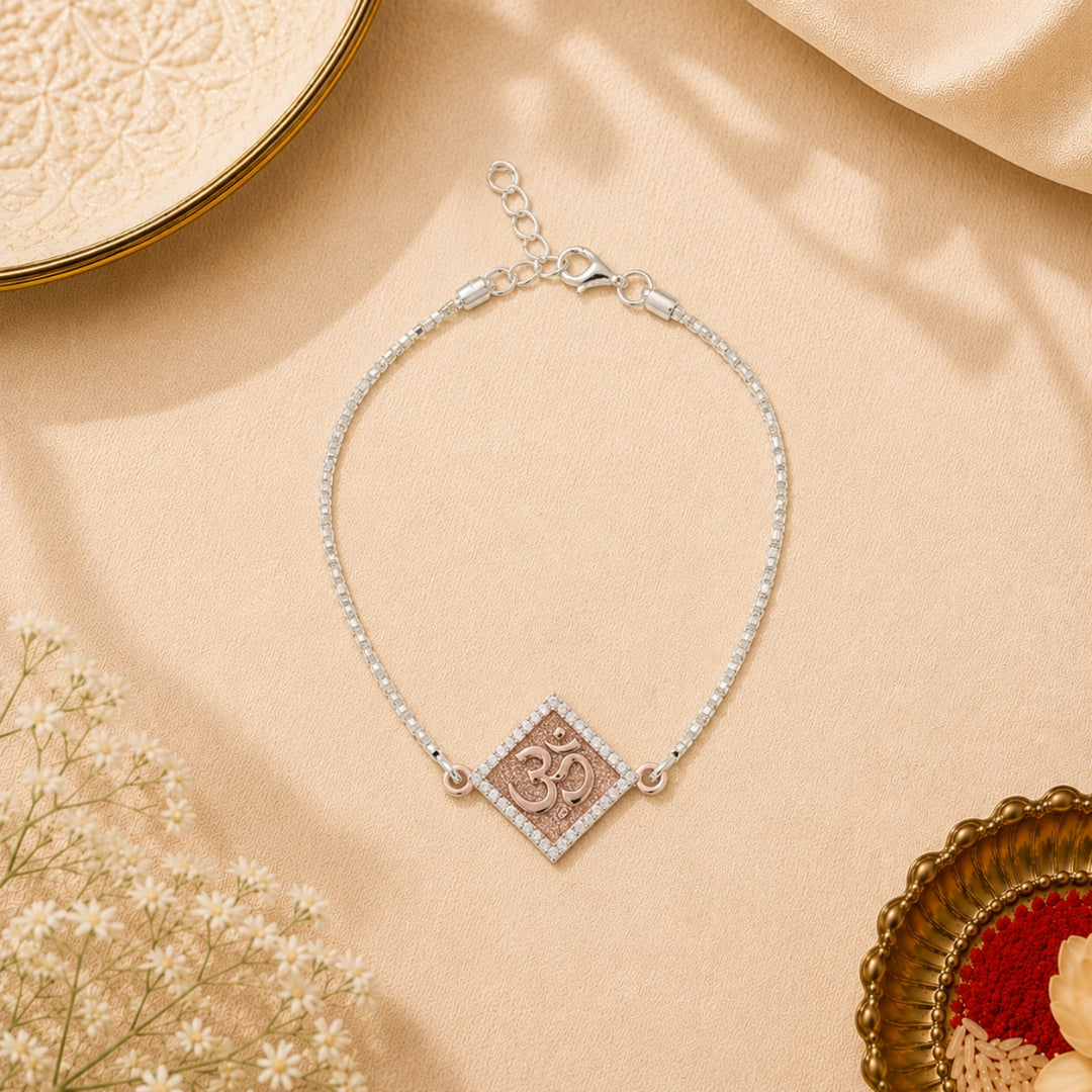 Sterling Silver Om Rakhi Bracelet for Kids placed with roli chawal and festive decor – premium 925 silver kids Raksha Bandhan gift by Silviya.