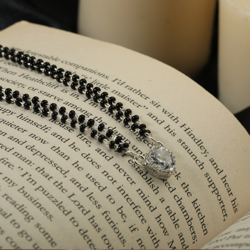 925 Silver Symbol of Love Mangalsutra displayed on festive background – traditional silver jewellery with graceful design.