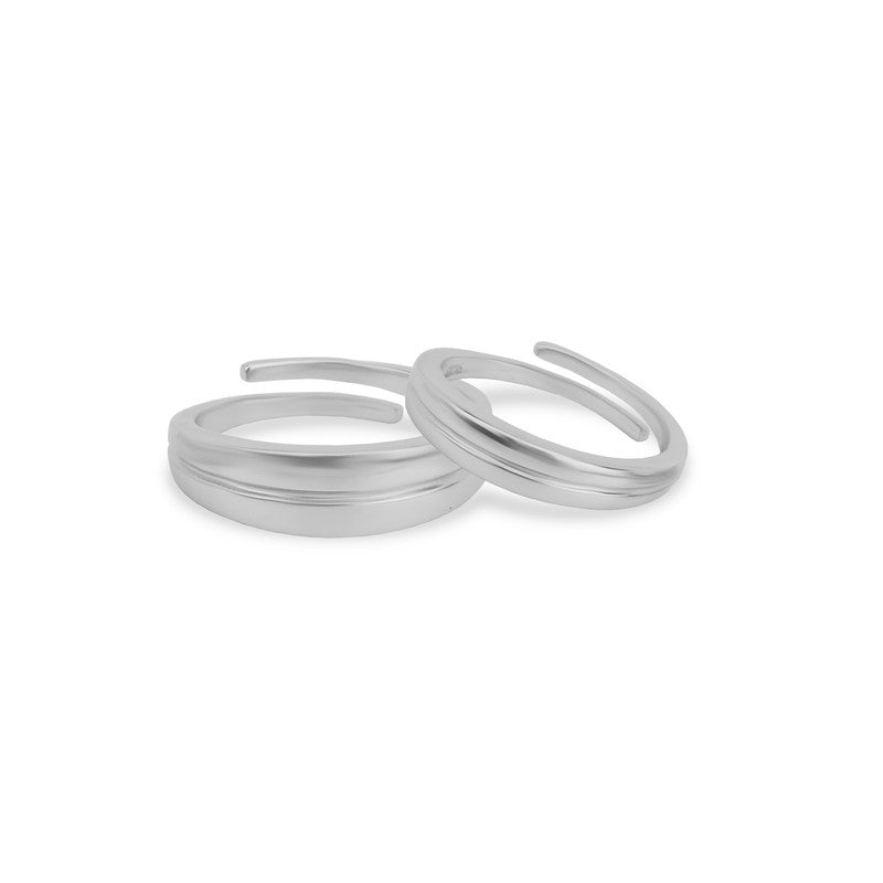 Trendy 925 Silver Couple Rings on white background – elegant silver jewelry