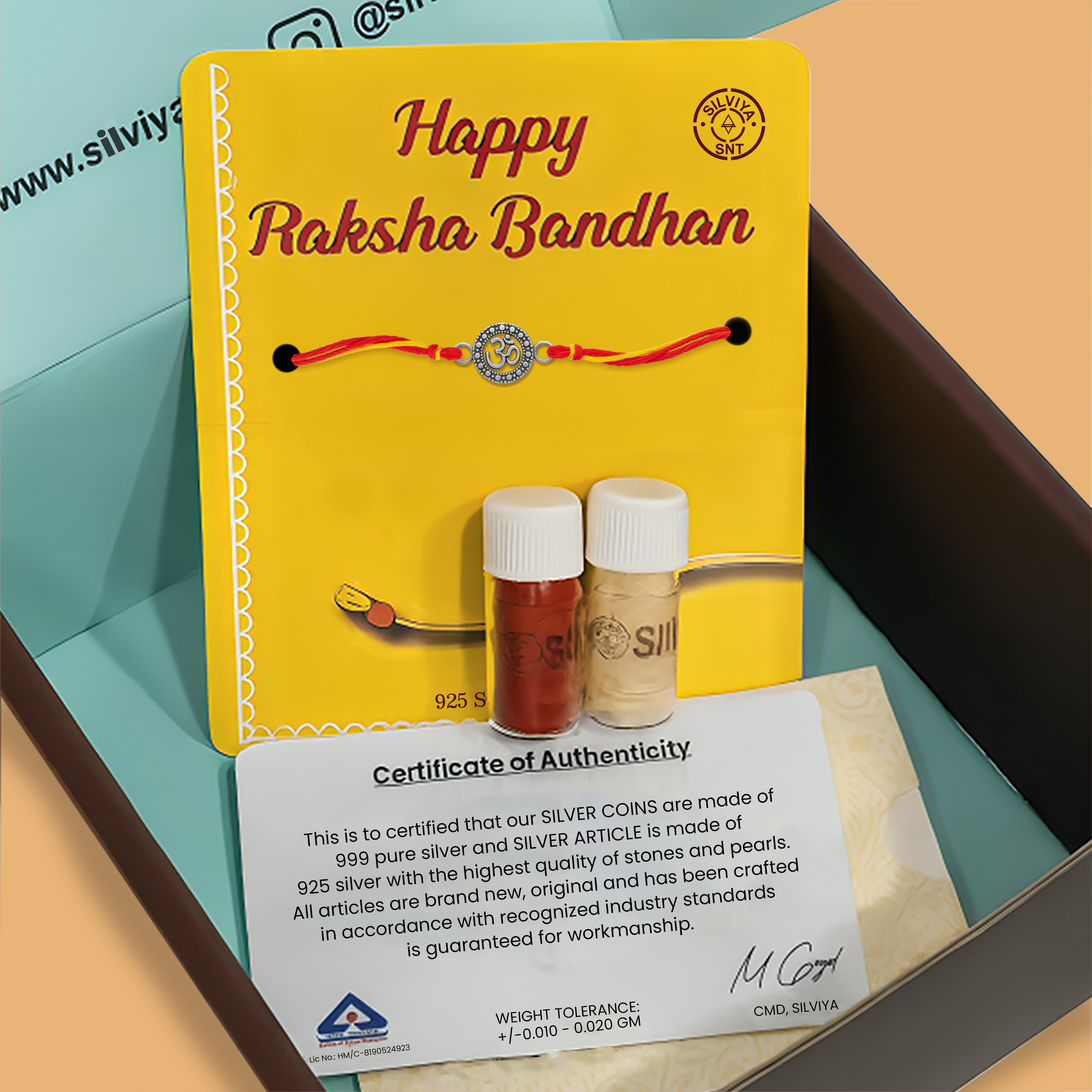 silver Om design rakhi gift set for Raksha Bandhan with roli chawal and certificate of authenticity from Silviya
