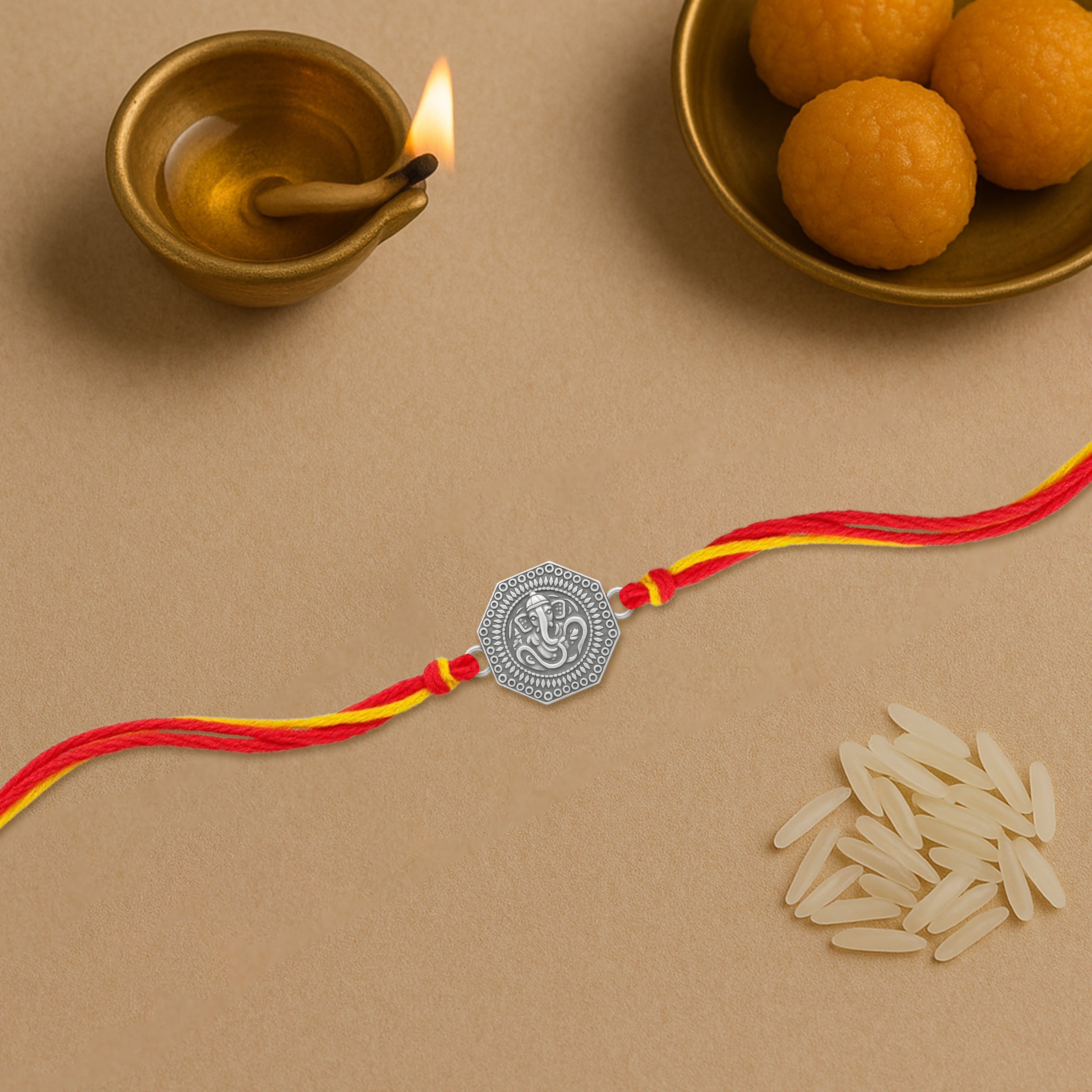 Silver rakhi for brother with Om and Ganesha design – original silver rakhi design with price
